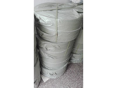 Plastic woven bag for roll material package